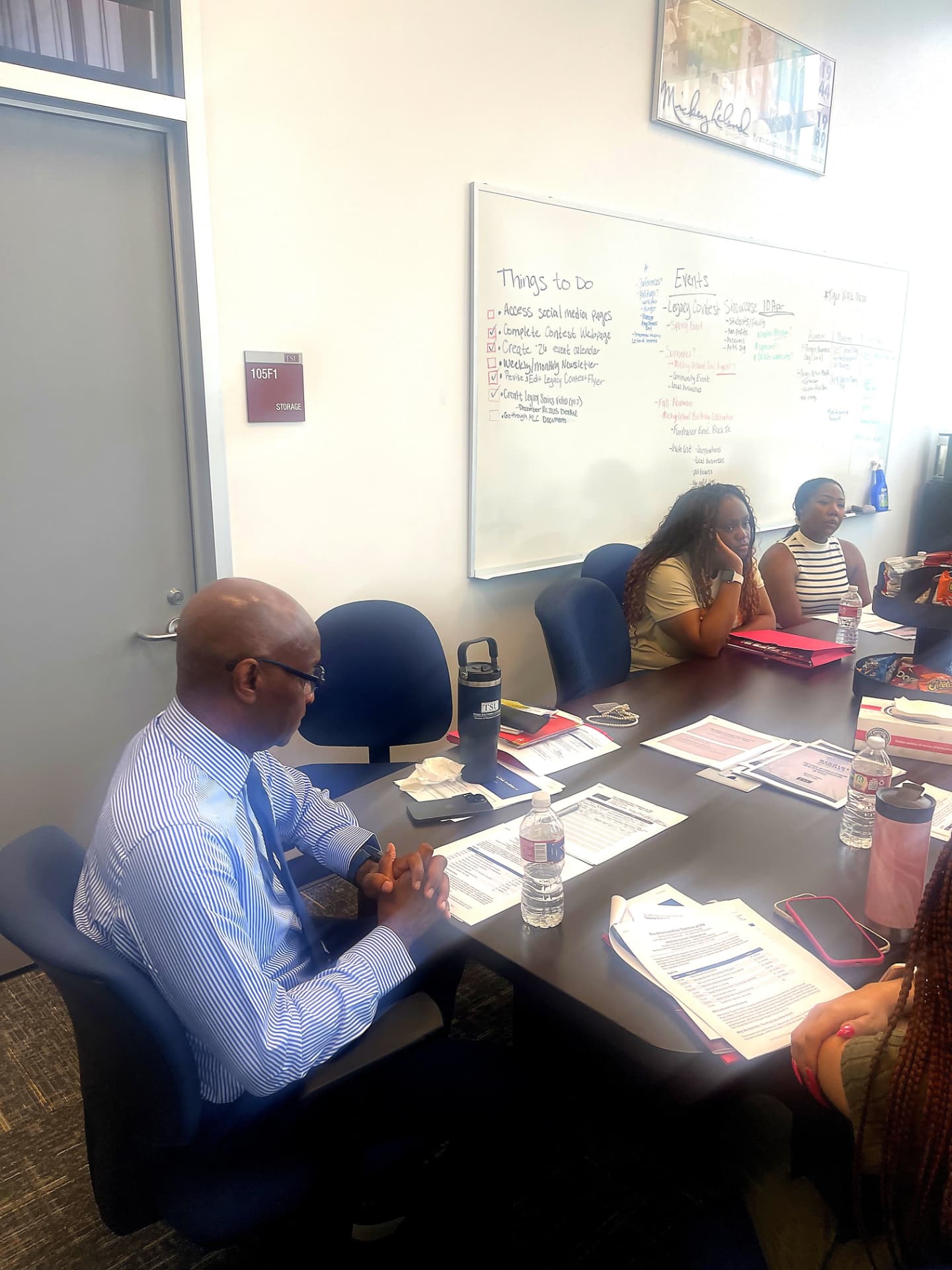 Dr. Michael O. Adams leading discussion with cohort teachers in front of a planning whiteboard at the July 2026 Civics Seminar.